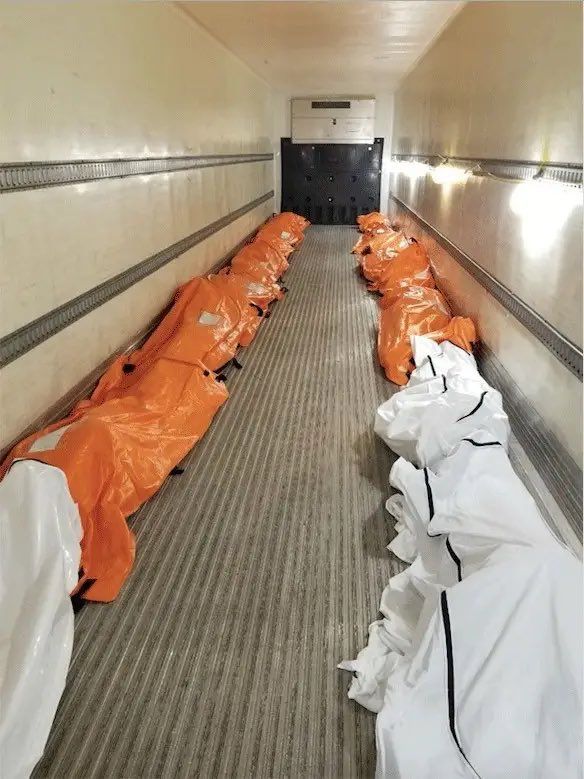 A refrigerator truck filled with body bags