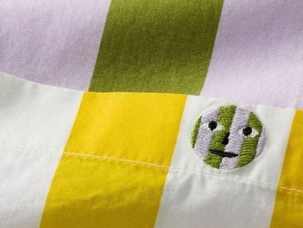 closeup of smiley face button on the pocket