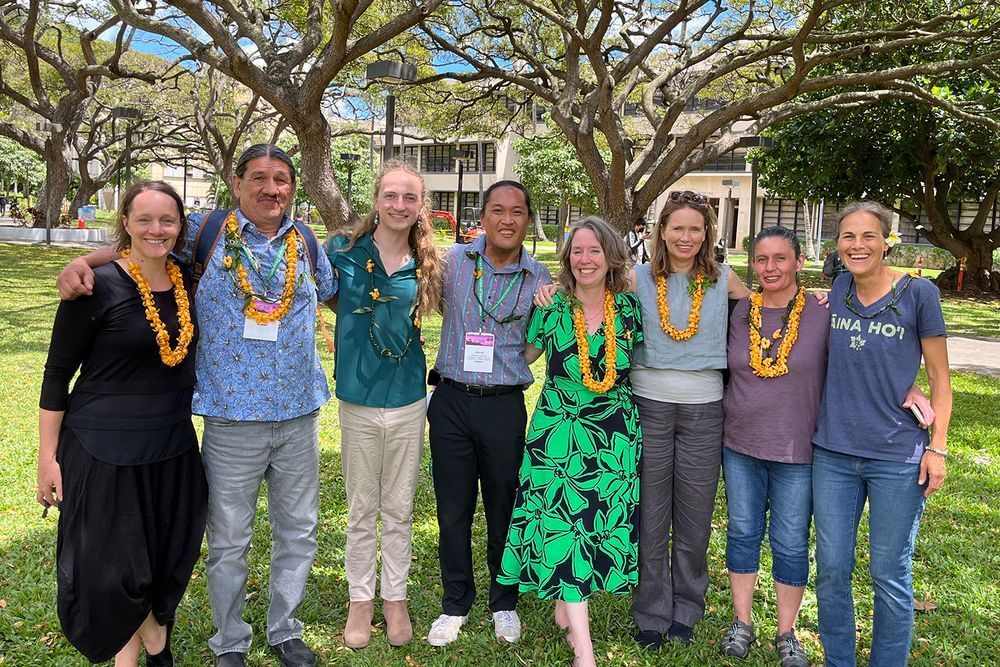 Stanford environmental scientist Sibyl Diver (fourth from right) co-presented at the American Association of Geographers 2024 conference with (from left) Mez Baker-Médard of Middlebury College; Ron Reed of the Karuk Tribe; John R. Oberholzer Dent from the Karuk Department of Natural Resources, Water Quality; Keoni Rodriguez from the University of Hawai'i; Jessica Weir of Western Sydney University; Robyn Reed of the Hoopa Tribe; and  Mehana Blaich Vaughan from the University of Hawai'i, Manōa. | Courtesy Sibyl Diver
