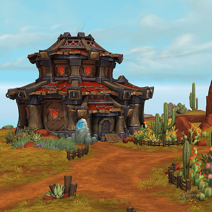 A house that looks similar to a hut with red and brown roofing sits in a desert landscape with orange soil, cacti, and glowing blue runestones. The path to the house is outlined with light brown fencing. On the right, a big boulder is adorned with tusks and hanging decorations. 
