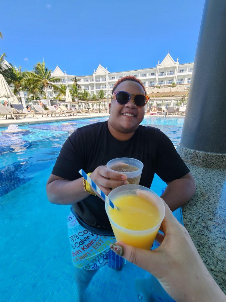 Me in a pool drinking a beer