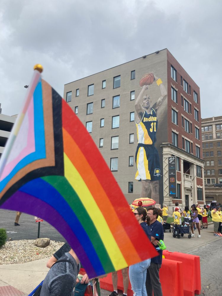 A pride flag set against the backdrop of “The Reggie Miller Mural” in downtown Indianapolis.

Also while we’re both here: Fuck Hate. Choose Love. 
