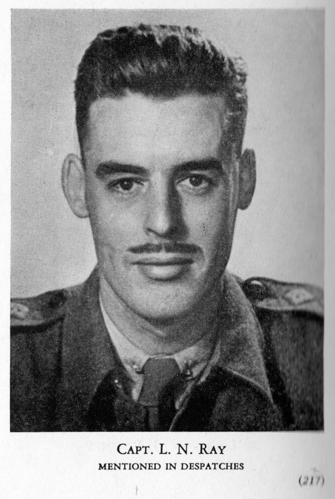 Black-and-white photo of young Canadian Army officer in uniform. Visible on one cheek is the recent scar of a combat wound.