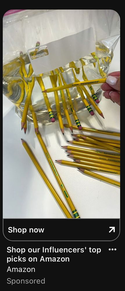 A screenshot of an Amazon ad showing several Ticonderoga pencils stabbed into a gallon ziploc baggie full of water