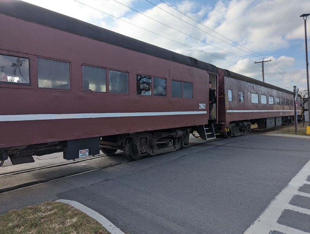 Train going by with "The Polar Express" written on the side of it.