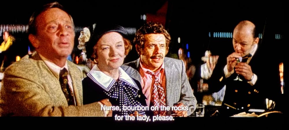 Norman Fell, Jerry Stiller and two other actors in a scene from Airport 1975