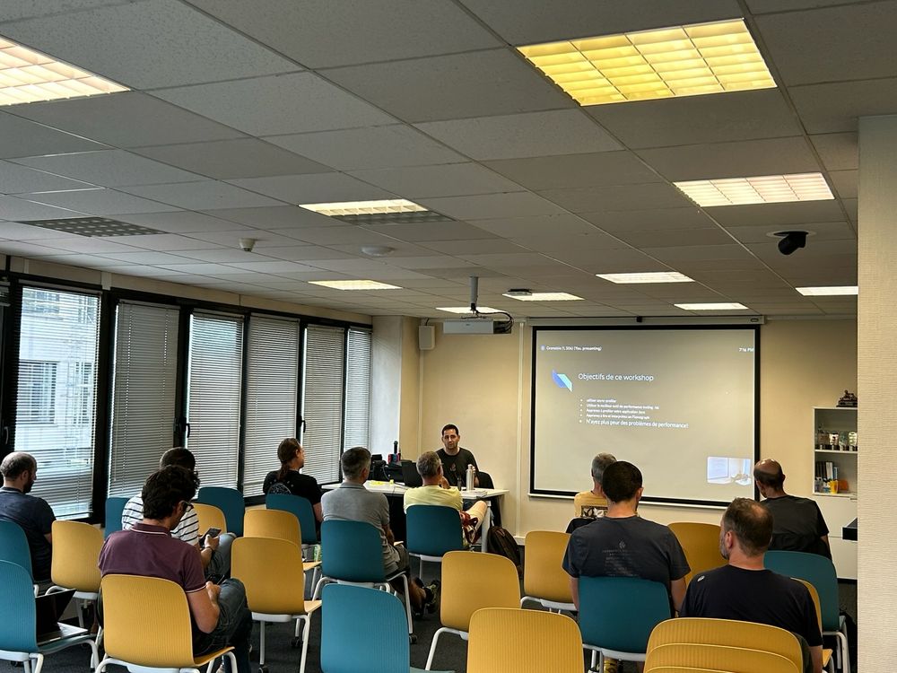 A speaker speaking in front of people