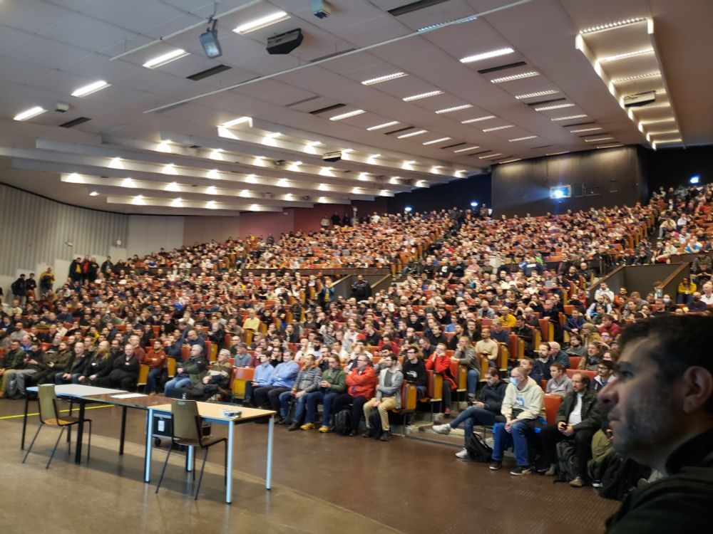 The FOSDEM public is listening to the opening session
