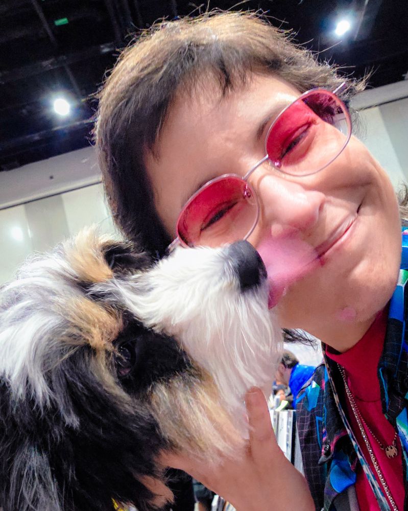 Dog licking woman's face