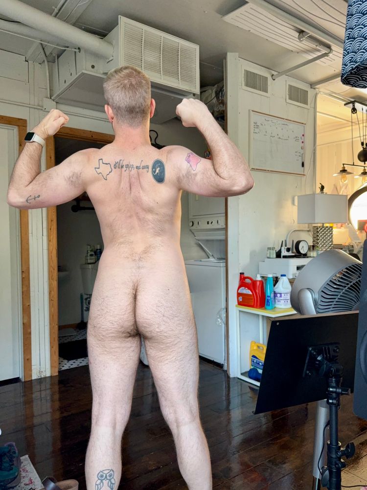 Nude back view with my arms up flexing 