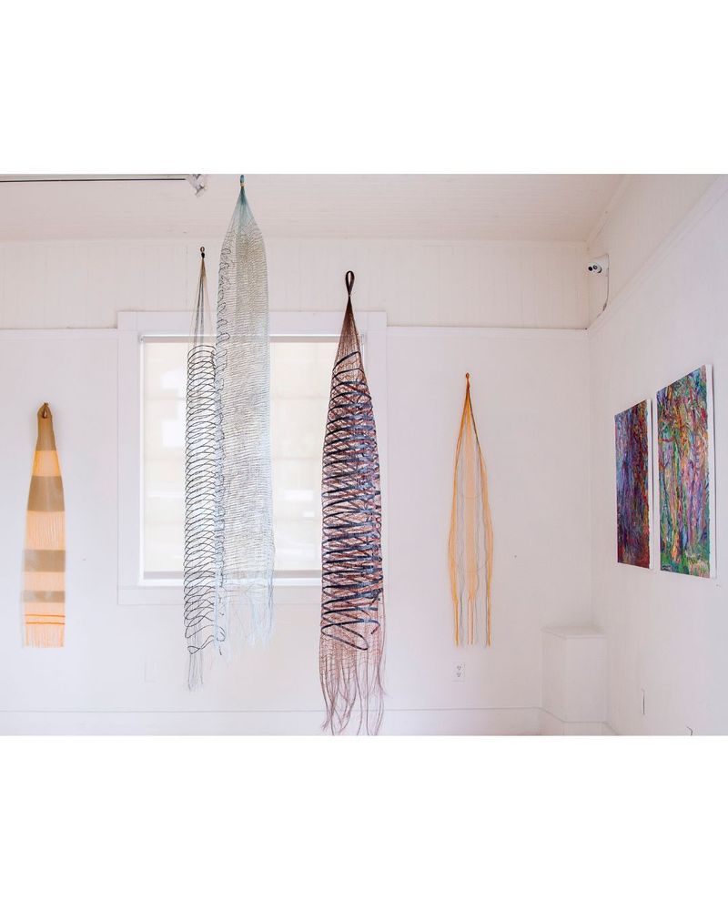 From left to right
1. MICHELLE YI MARTIN, “Altar Cloth,” 2025, cotton, monofilament, 57  x 10 inches, courtesy of the artist.
2. MICHELLE YI MARTIN, “Underland,” 2021, jute, horsehair, monofilament, 60 x 7 inches, courtesy of the artist.
3. MICHELLE YI MARTIN, “Lacewing,” 2025, monofilament, horsehair, wool, paper, 52 x 26 inches, courtesy of the artist.
4.  MICHELLE YI MARTIN, “Two Adders,” 2024, monofilament, paper, wool, 53 x 34 inches, courtesy of the artist. 
5.  MICHELLE YI MARTIN, “Moth Cyana,” 2023, cotton, monofilament, horsehair, wood, 65 x 14 inches, courtesy of the artist.
