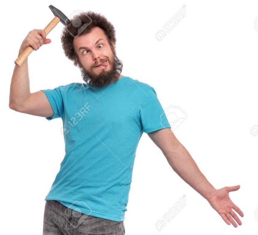 A man hitting himself in the head with a hammer 