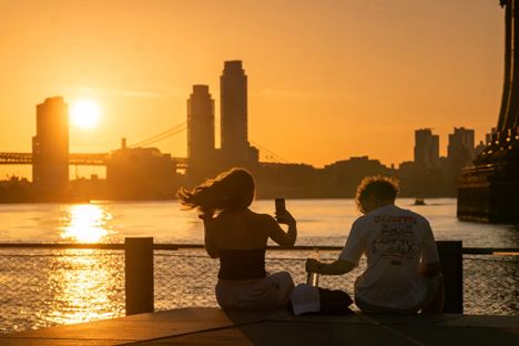 The sun rises over Manhattan on June 24, 2025, in New York City as the first heat wave of the year moves across parts of the Midwest and East Coast.
Image credit: Spencer Platt/Getty Images
