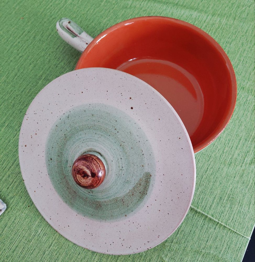 A clay pot on a green background 