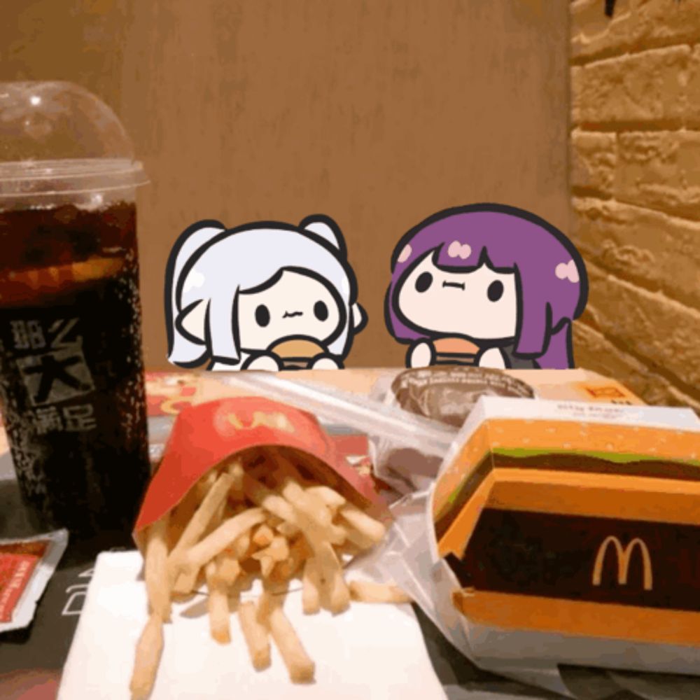 a mcdonald 's hamburger and french fries on a table