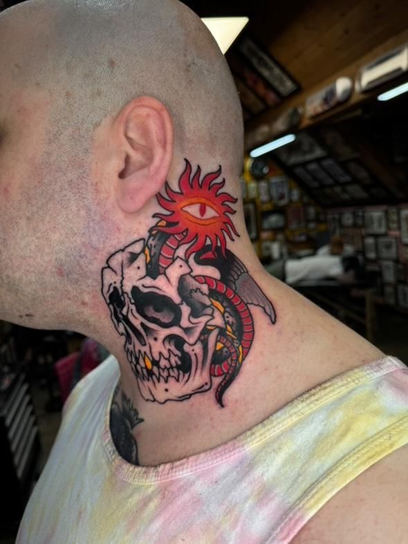 Skull tattoo on neck
