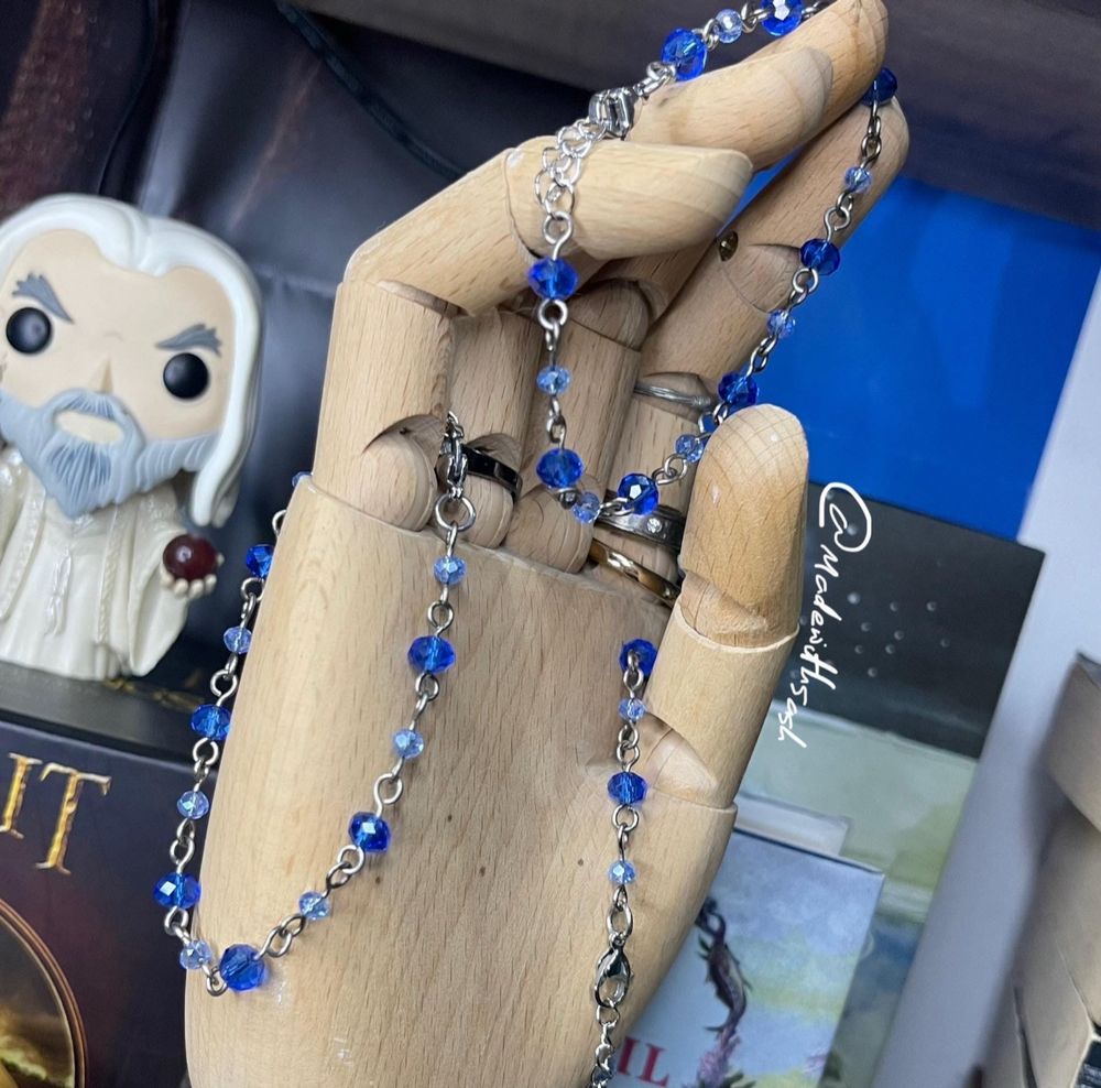 three blue chain bracelets dangling from a wooden hand mannequin. these are handmade bracelets using glass beads, titanium and stainless steel. 
there are two different blue beads used: 6mm ‘sapphire’ blue rondelle beads, and 4mm ‘ice blue’ round beads.
the beads are singular and isolated, alternating between the two, connected with titanium wire loops.

sensitive skin friendly!

‘bluebell’