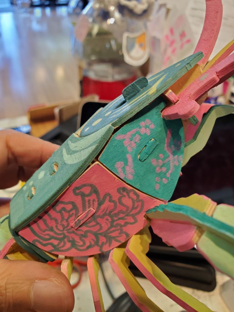 Side of lobster has flower designs.