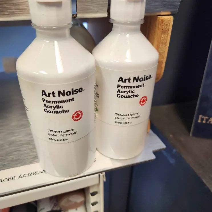 Bottles of Tri-Art "Art Noise" acrylic gouache on display.