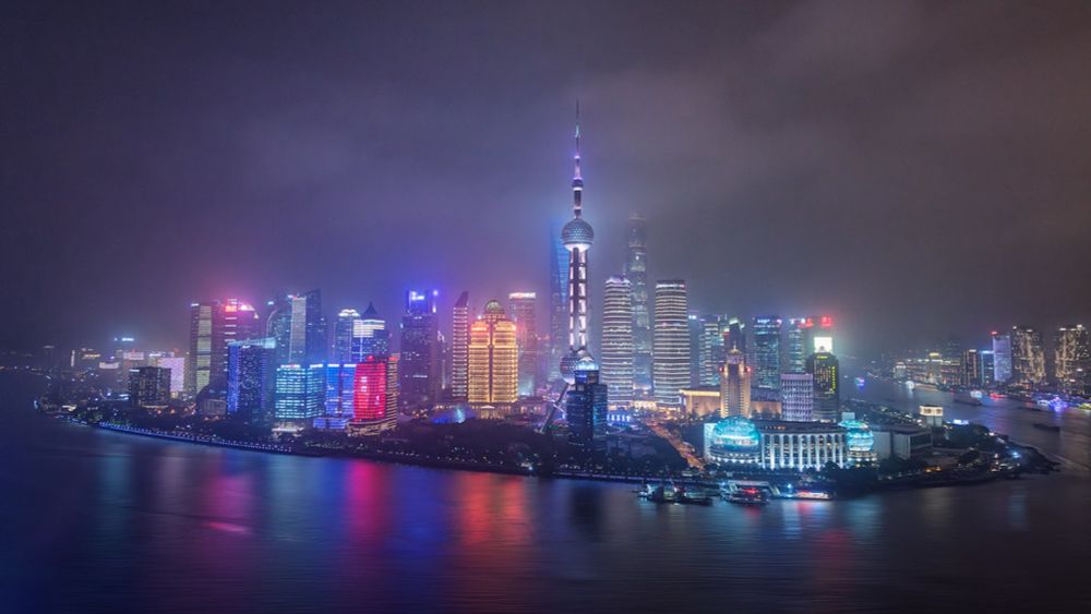 The towers of Lujiazui pierce the fog like neon spires, casting spectral reflections across the Huangpu.

Shanghai’s financial heart glows with futuristic grandeur, veiled in mist and electric silence.