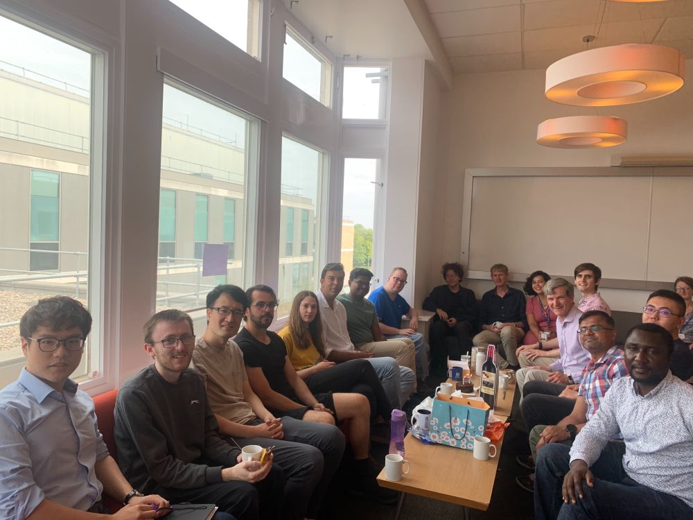 The group, sat around the table, celebrating Ifor's birthday!