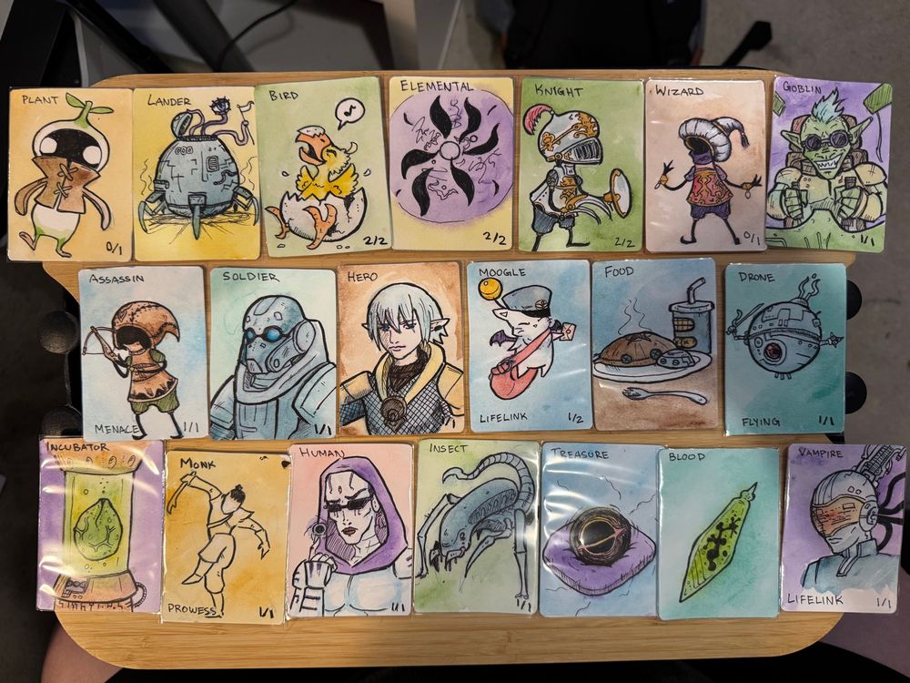 watercolor magic the gathering tokens of:
top row: plant, lander, bird, elemental, knight, wizard, goblin
middle row: assassin, soldier, hero, moogle, food, drone
bottom row: incubator, monk, human, insect, treasure, blood, vampire