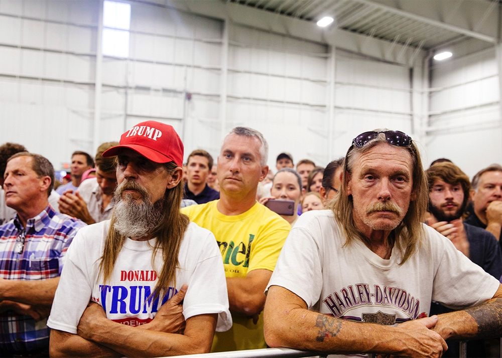 Tired-looking white men at at Trump event.