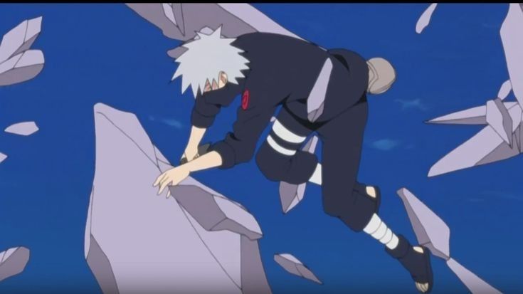 Kakashi floating into the air surrounded by debris bent forward with his hands just short of grabbing at one of the pieces of debris