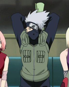 Kakashi sitting in between Sakura and Ino, he has his arms thrown behind the back of his head, holding a rolled up paper.