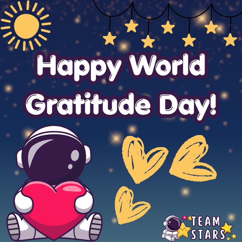 text on the screen is white with a dark purple outline and reads, "happy world gratitude day!" the image has a dark blue background with blurred yellow stars. there is a sun in the top left corner, star garland in the top right, an astronaut with a pink heart in the bottom left, some yellow hearts in the bottom right, and an astronaut logo that reads, "team stars" 
