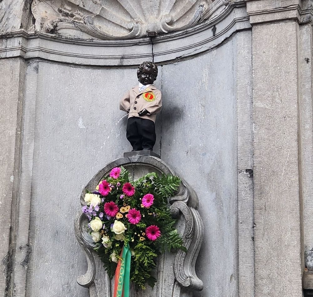 The Manneken Pis, in Brussels: a statue of a little boy having a pee. He's been dressed up in a little suit jacket.