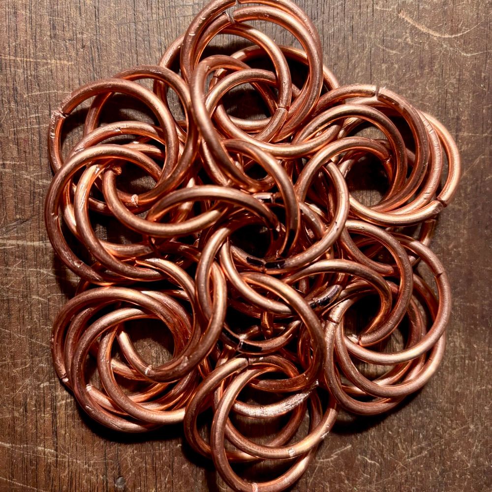 A copper ring, nested in another, and another. Interlocking, separate rings neatly wrapped together forming a #Mobius… Each ring is coming out the bottom, rising to the top, and diving back into the center. These rings, this mobius, is connected to six more mobius’ of six rings each, … which are connected to each other… I’ll add more and more rings forming a #Matrix/#Web/#Weave that will be impossible to rip apart. 