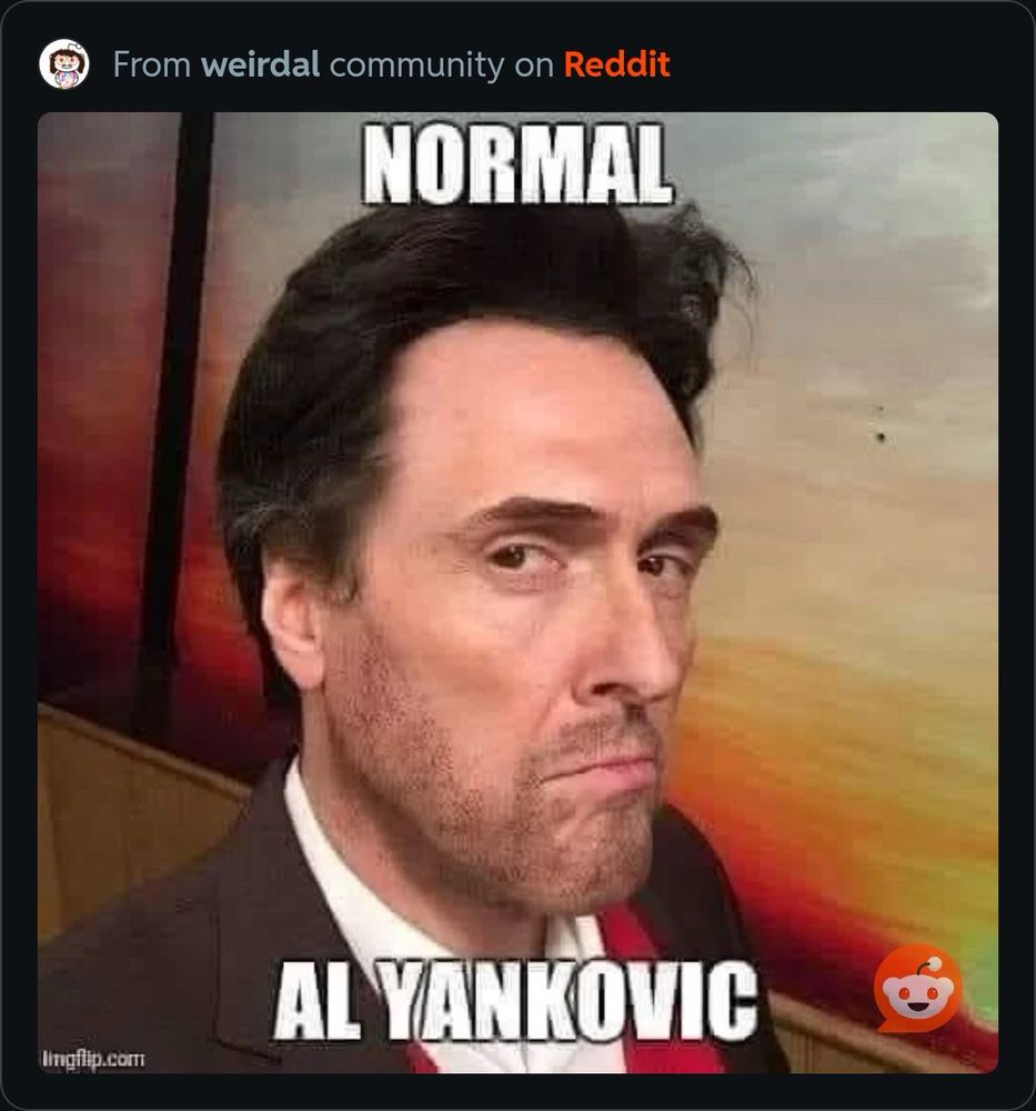 “Normal Al Yankovic” with a modern sport jacket, his face with a calm intense expression, and thick normal dark hairstyle 