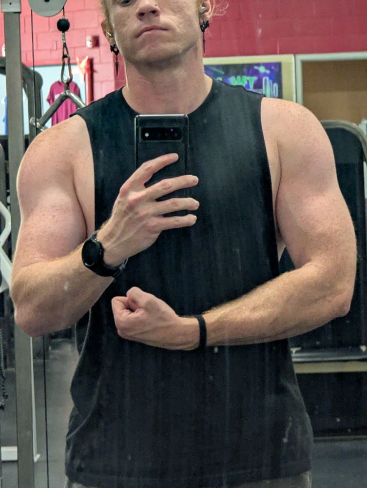 The game designer of Aero GPX takes a cheeky selfie in an empty gym, with muscles filled with both rage and water. He's not all that big or strong (yet) but he's getting there.
