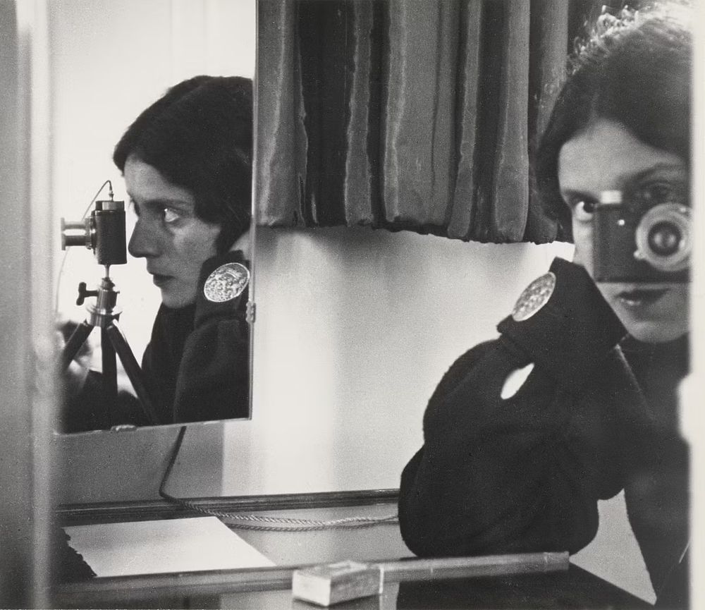 Ilse Bing left her native Germany and moved to Paris – the center of the art world – in 1929. In Paris, she flourished as a commercial photographer, freelancing for a variety of magazines, while also finding time to show her avant-garde photos in gallery shows. Bing’s “Self-Portrait in Mirrors” (also sometimes titled “Self-Portrait with Leica”) is a great example of her innovative and intuitive use of photography as an art form. This shot is actually a double portrait, showing both a front view and a side view with missing elements from one view (for example, her nose) being filled in by the other view: two points of view shown simultaneously as separate images within one frame. Genius! When the Nazis overran Paris in 1940, Bing was sent to an internment camp in the south of France. She was able to secure a visa and emigrated to New York City in 1941. Her photographic output slowed in the US and she put her camera down for good in 1959 to concentrate on writing poetry. Her impact on modern photography remains impressive, as she was among the first to use solarization, the electric flash and night compositions.