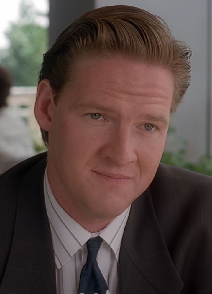 Agent Tom Colton from X-Files. A plain looking white guy with a light brown combover wearing a suit. 