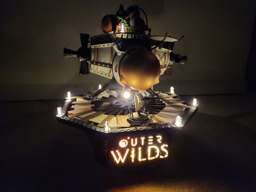 view of the hearthian lander in the dark with lights on