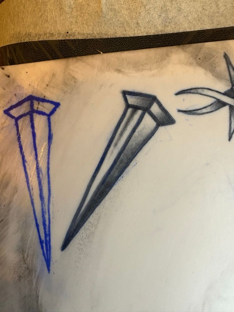 Tattoo on fake skin of a coffin nail