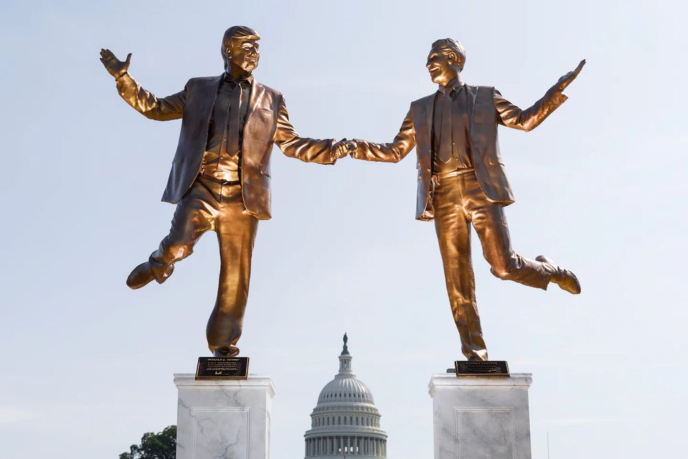 A statue featuring President Donald Trump and deceased financier Jeffrey Epstein outside the U.S. Capitol on Tuesday on the National Mall in Washington. The statue, which depicts the two dancing, was titled, “Best Friends Forever.” (Tom Brenner/For The Washington Post)