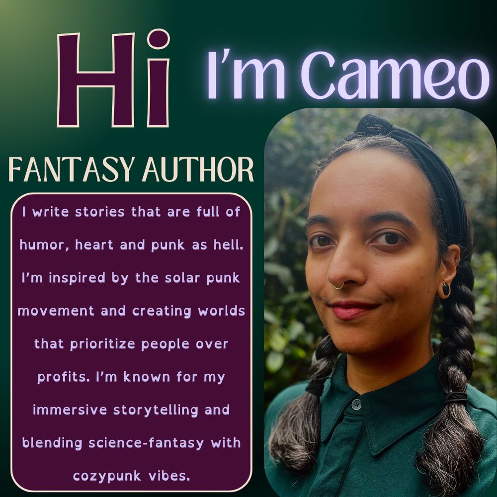 Image description: A headshot of a Black person with long, braided black hair and brown eyes looking into the camera.  They are wearing a dark green button down, red lipstick and standing in front of a forest.