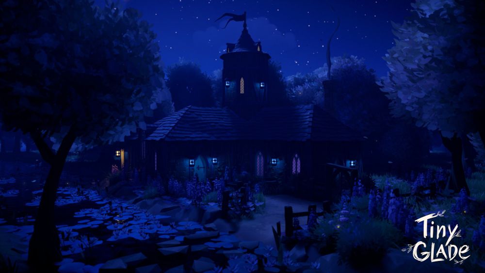 A screenshot of the game Tiny Glade, a dark cottage with a tower stands near a river surrounded by trees, at nighttime