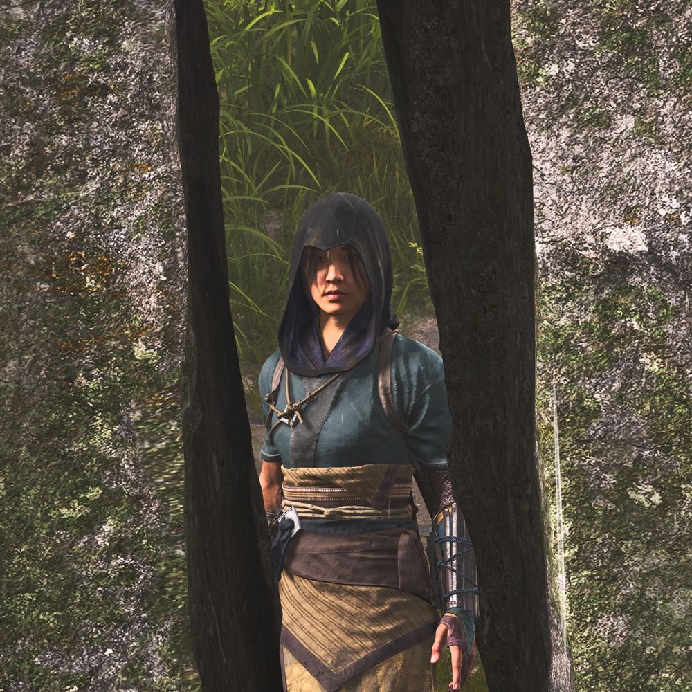 Framed by a rock sundered in two by the elements, Naoe gazes at the viewer. 