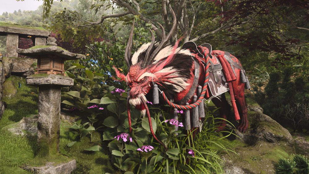 The red dragon with white and black fur and ropes and tassels in a garden with purple flowers and an old Japanese stone lantern. 