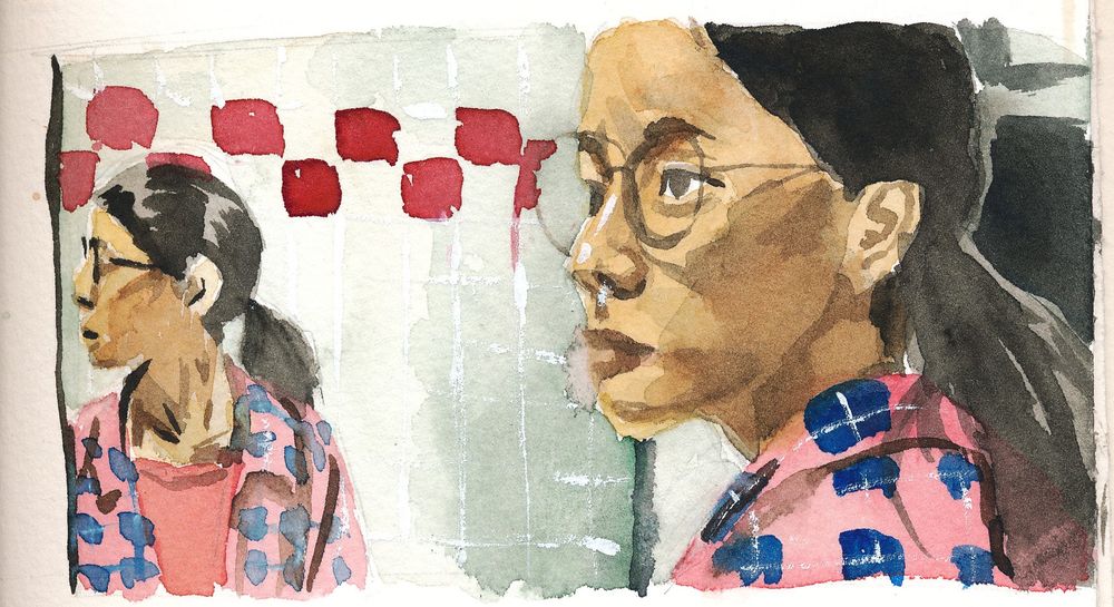 Small watercolor painting of a Chinese girl with glasses, a ponytail and a lumberjack shirt. She is looking to the side, and opposite her we see her mirror image in front of a tiled bathroom wall with some red accent tiles.