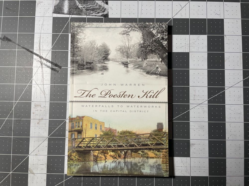 Cover of the book The Poesten Kill by John Warren. Shows a black and white image of the stream and a color image of a bridge over the stream in the city of Troy, New York. 