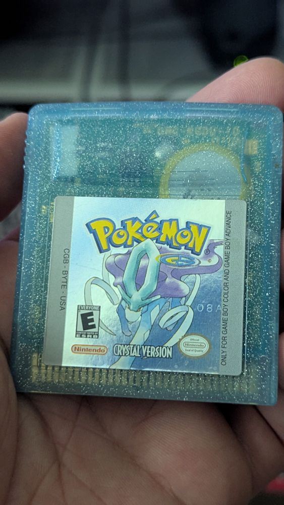 A cherished used copy of Pokémon Crystal that my boyfriend bought for roughly $150.  He had it sent to me so I could replace the battery, which was long dead; thus, the game could not save anymore.
