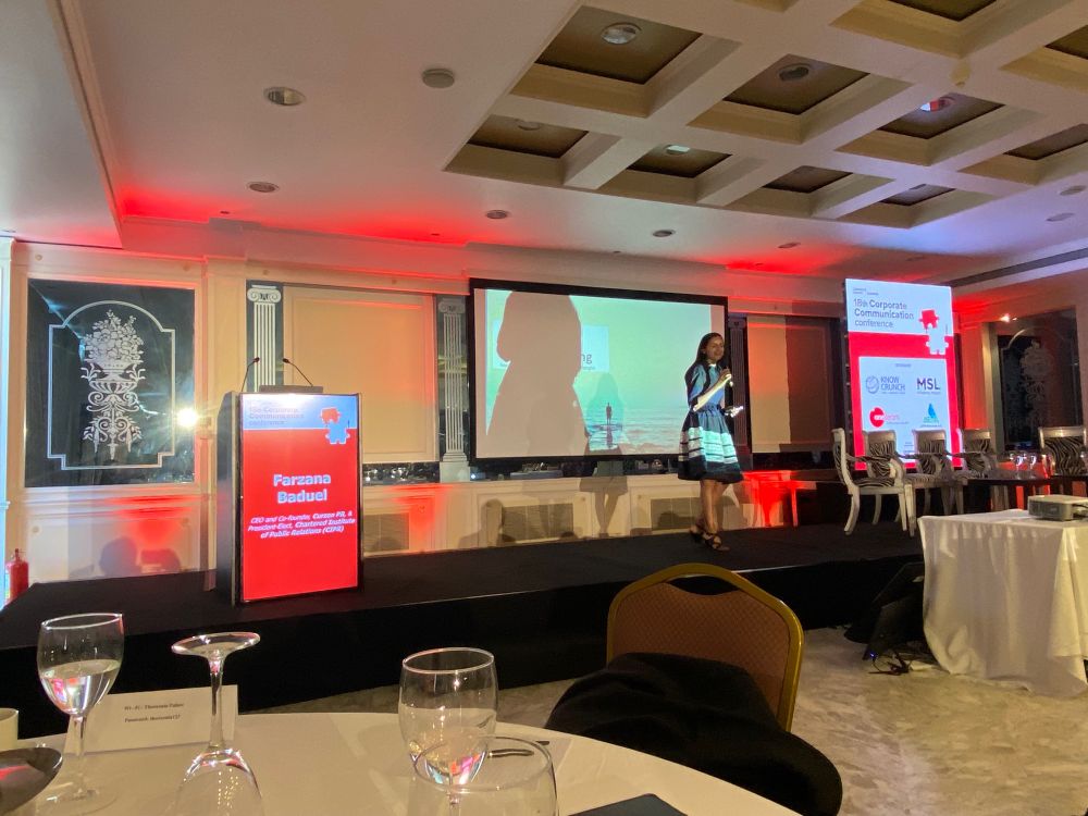 Farzana Baduel on stage at the corporate communications conference 