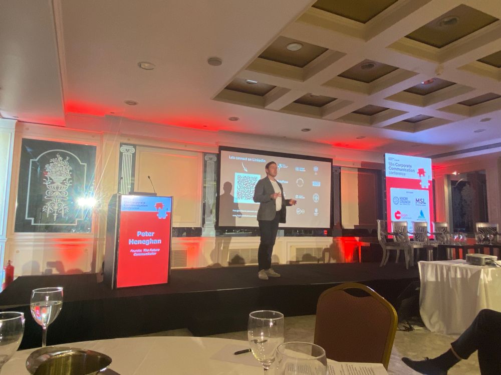 Peter Heneghan on stage at the corporate communications conference 