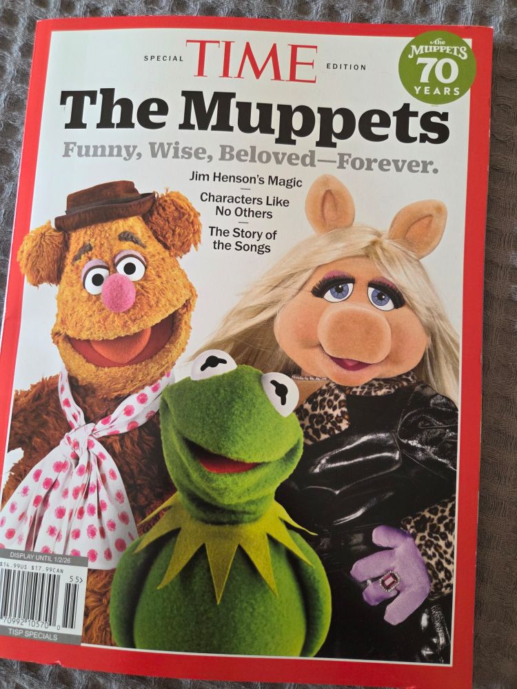 Time magazine special edition cover showing the Muppets Fozzie Bear, Miss Piggy and Kermit the Frog. The Muppets 70 years logo is in the corner and a subtitle of: Funny, Wise, Beloved--Forever. Jim Henson's magic - characters like no others - the story of the songs.