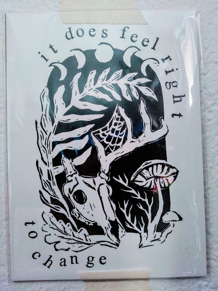 The words "It does feel right to change" around a crown of phases of the moon, plants, spider webs, mushrooms, and a stag skull.